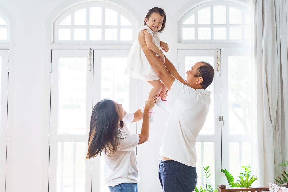 toddler and parents candid playing in Oh Dear Studio