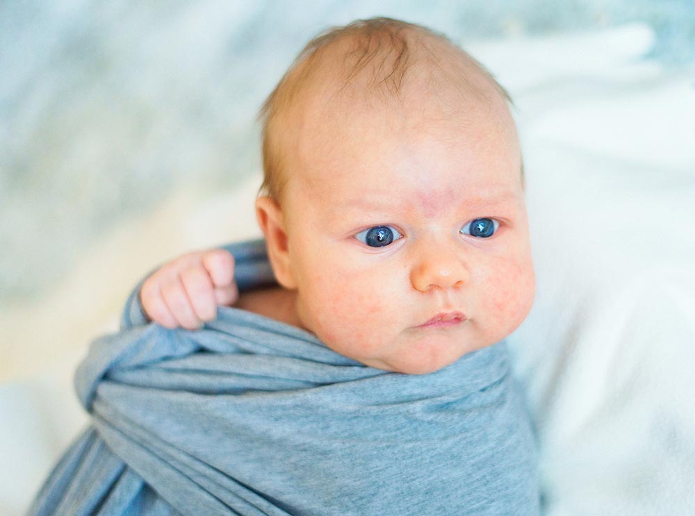 swaddled baby natural light home photoshoot
