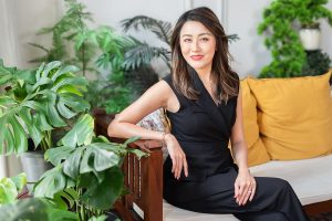 bank corporate lady smiling green plants on sofa