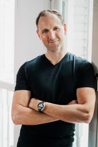 corporate creative smart casual how to pose window natural light studio expat man smiling