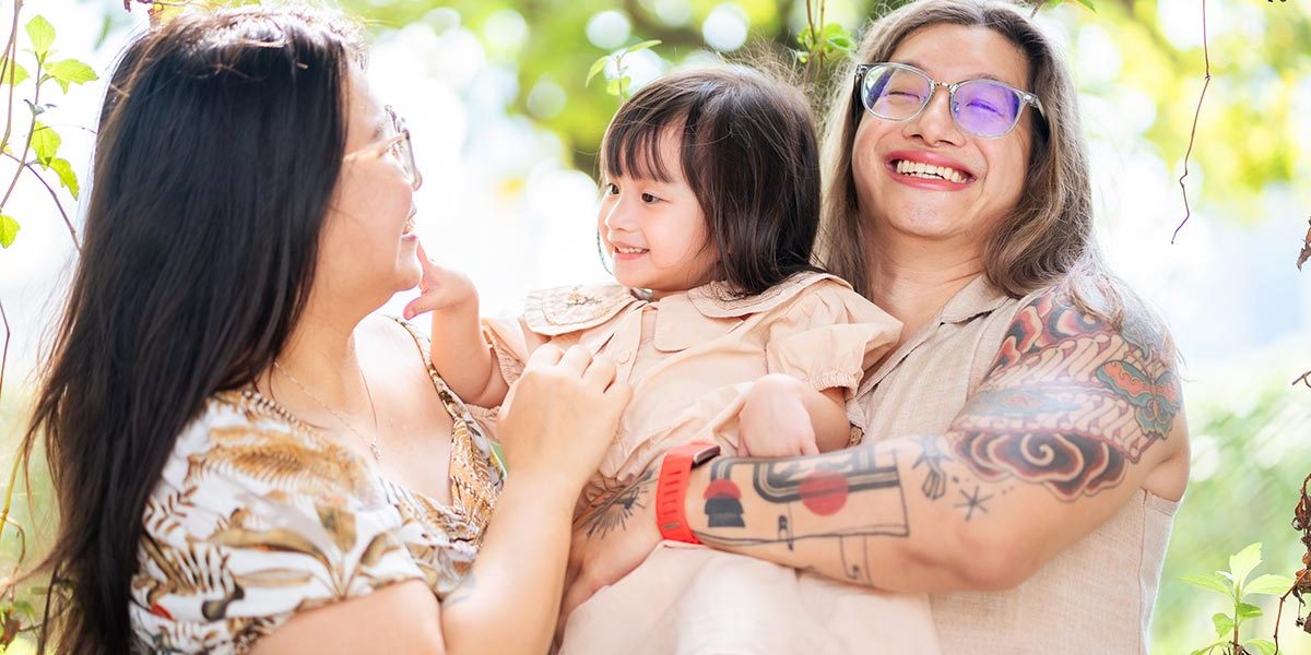 Autism-friendly-family-photographer-in-Singapore-capturing-a-candid-moment-with-an-LGBTQ+-family-at-a-hotel-session Autism friendly family photographer in Singapore capturing a candid moment with an LGBTQ+ family at a hotel session