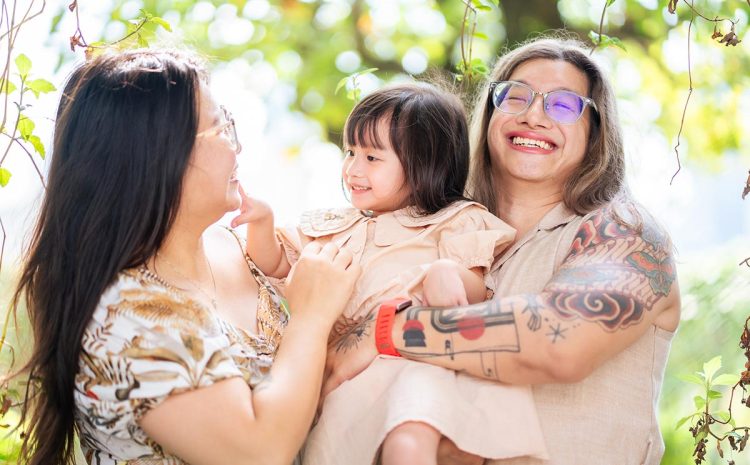Autism-friendly-family-photographer-in-Singapore-capturing-a-candid-moment-with-an-LGBTQ+-family-at-a-hotel-session Autism friendly family photographer in Singapore capturing a candid moment with an LGBTQ+ family at a hotel session